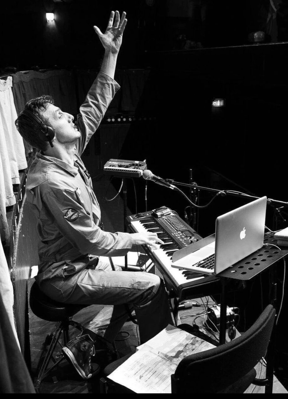 Chris at a keyboard during a live performance